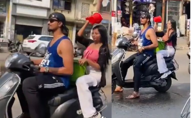 गर्मी ने किया बेहाल, तो चलती स्कूटी पर ही नहाने लगे लड़का-लड़की, एफआईआर दर्ज 5 Untitled design 41 1
